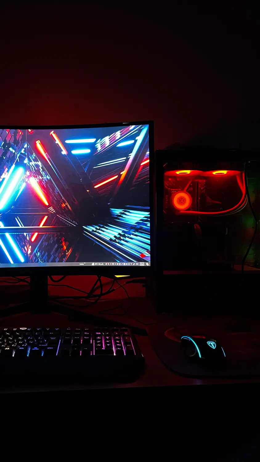 Station with monitor, keyboard and mouse lit by RGB